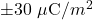 \pm30~\mu\mathrm{C}/m^2