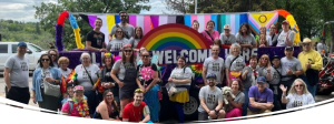 Pride Parade in Saskatoon, 2025. Participants from Saskatchewan Polytechnic posing in front of our float.