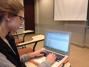 1200px-Student_with_computer