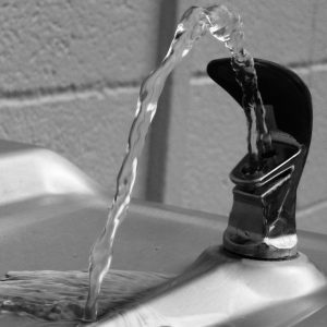 Clear water flows from a public drinking fountain." title="Clear water flows from a public drinking fountain.