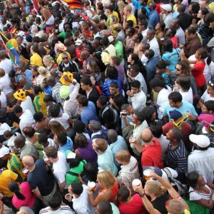 A huge crowd of people stand shoulder to shoulder during the World Cup in 2010.