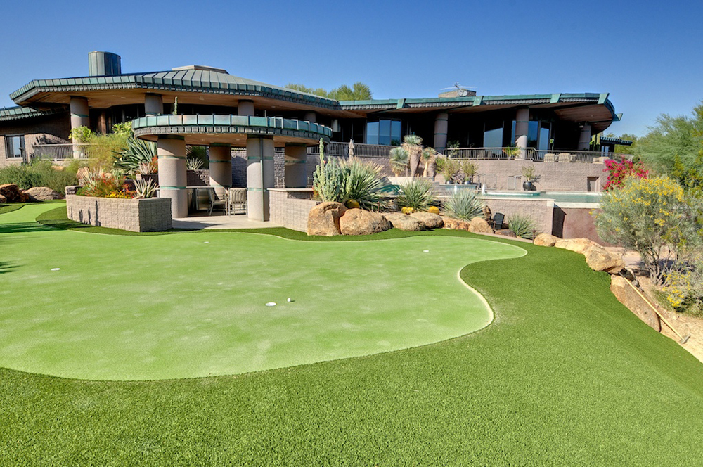 A luxurious house with a golf course.