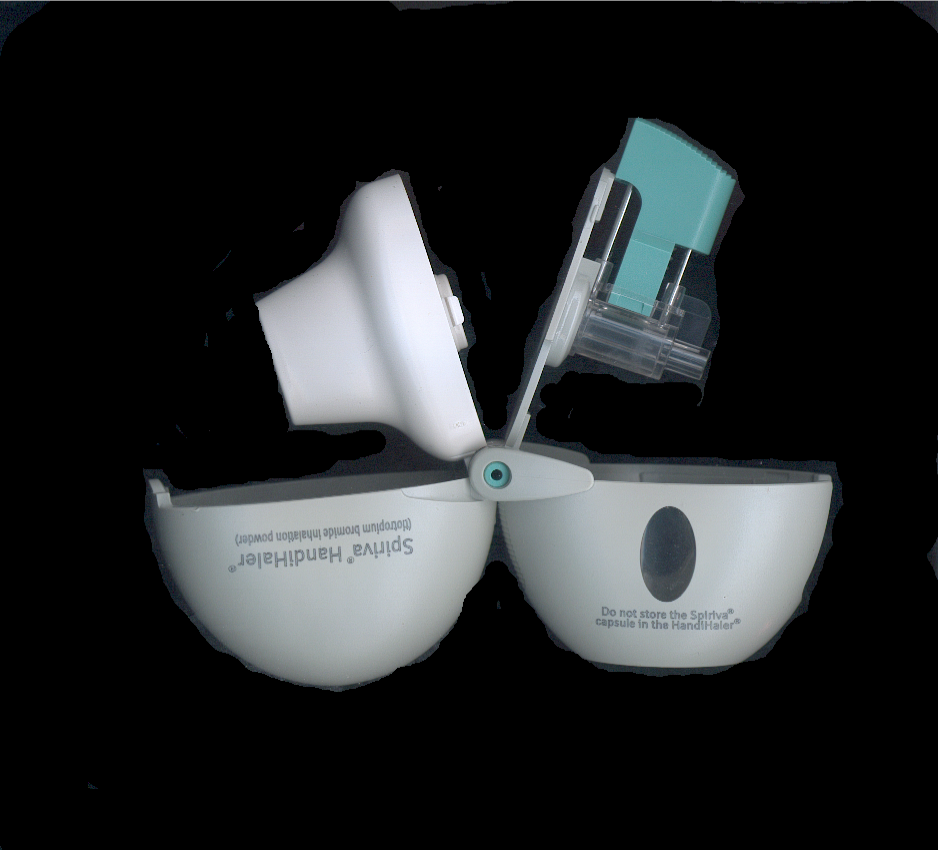 "Spiriva HandiHaler"-brand dry powder inhaler (open).png" by RonEJ at English Wikipedia is licensed under CC0 1.0 Photo of dry powder inhaler