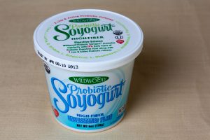 "WildWood Probiotic Soyogurt" by Veganbaking.net is licensed under CC BY-SA 2.0 Photo of probiotic yogurt in container.