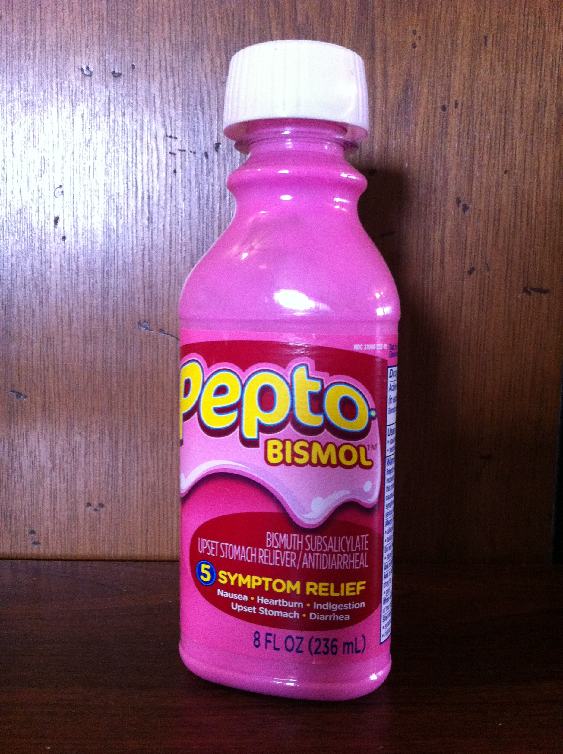 "PeptoBismol Bottle.JPG" by ParentingPatch is licensed under CC BY-SA 3.0 Photo of Pepto Bismol bottle