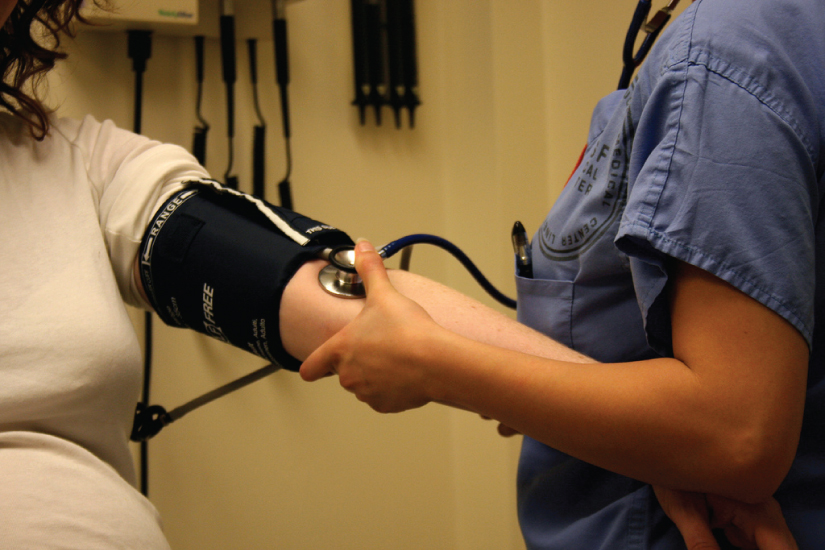 "Blood Pressure" by Bryan Mason is licensed under CC BY 4.0 Photo showing blood pressure being taken