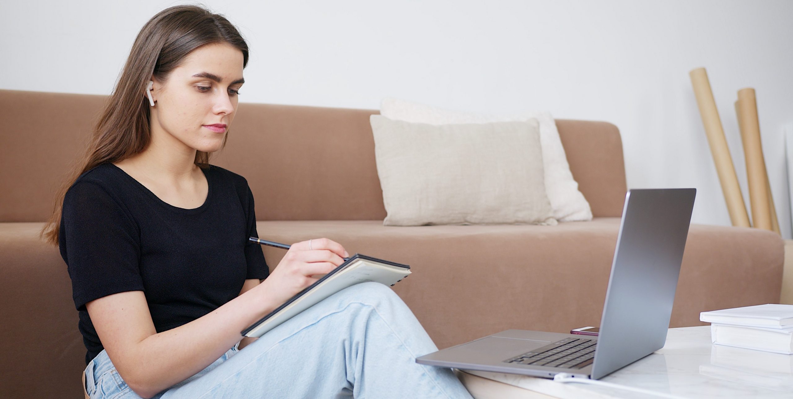 Woman sitting on floor studying