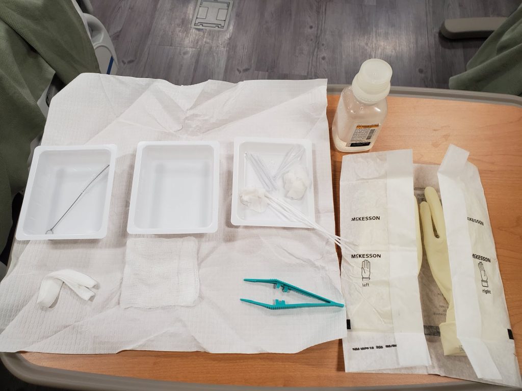 “Sterile Tracheostomy Care Kit” by Julie Teeter at Chippewa Valley Technical College is licensed under CC BY 4.0 Photo showing open Sterile Tracheostomy Care Kit