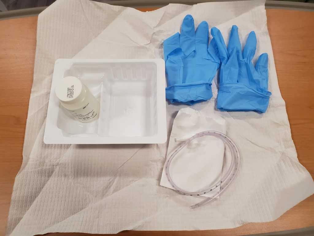 “Example of a Sterile Tracheostomy Kit” by Julie Teeter at Chippewa Valley Technical College is licensed under CC BY 4.0 Photo showing open sterile tracheostomy kit