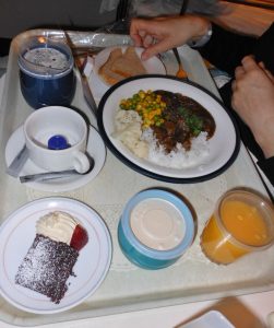 “Hospital Meal” by Michael Coghlin is licensed under CC BY-SA 2.0 Photo showing a hospital meal, with beverages, entree, and dessert