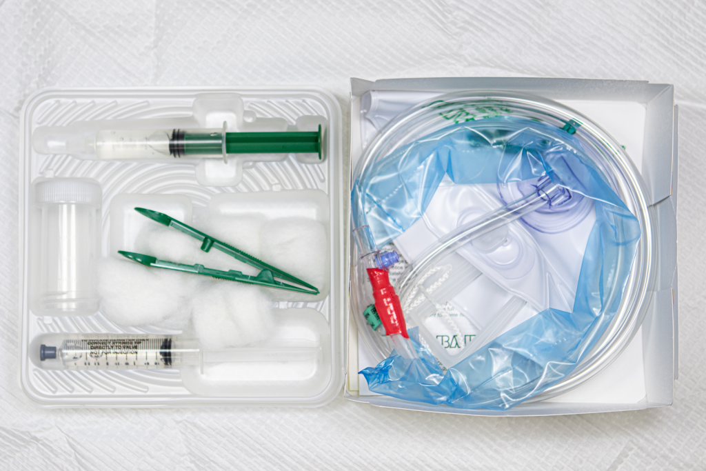 ”Open Foley Kit 3I3A0654.jpg” by Deanna Hoyord, Chippewa Valley Technical College is licensed under CC BY 4.0 Photo showing a Foley Catheter Kit