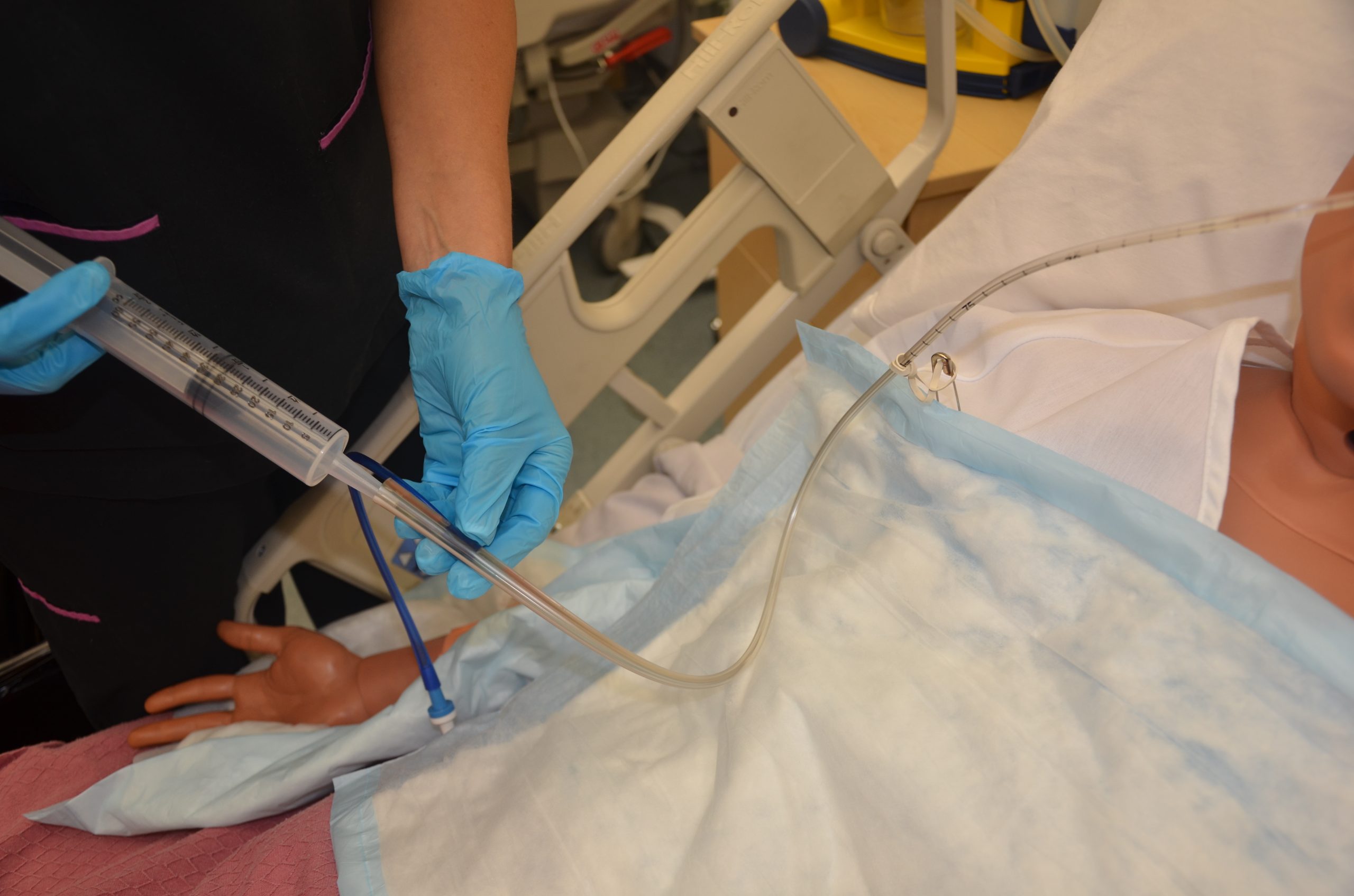 “DSC_1667.jpg” by British Columbia Institute of Technology (BCIT) is licensed under CC BY 4.0. Access for free at https://opentextbc.ca/clinicalskills/chapter/10-2-nasogastric-tubes Photo showing irrigation of NG Tube on simulated patient
