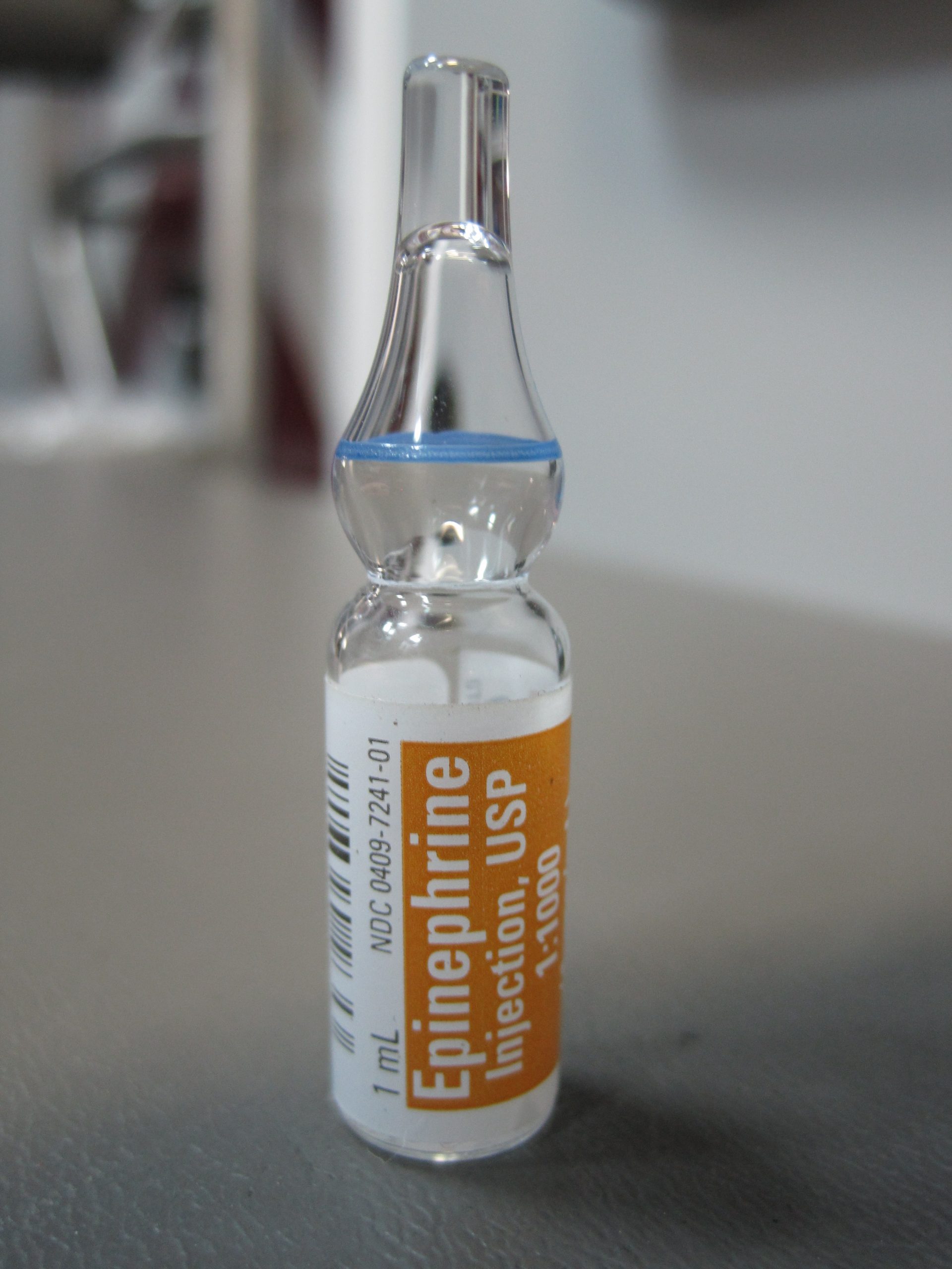 “Epinephrine 1-1000 (1).JPG” by Intropin is licensed under CC BY 3.0 Photo showing closeup of an epinephrine ampule