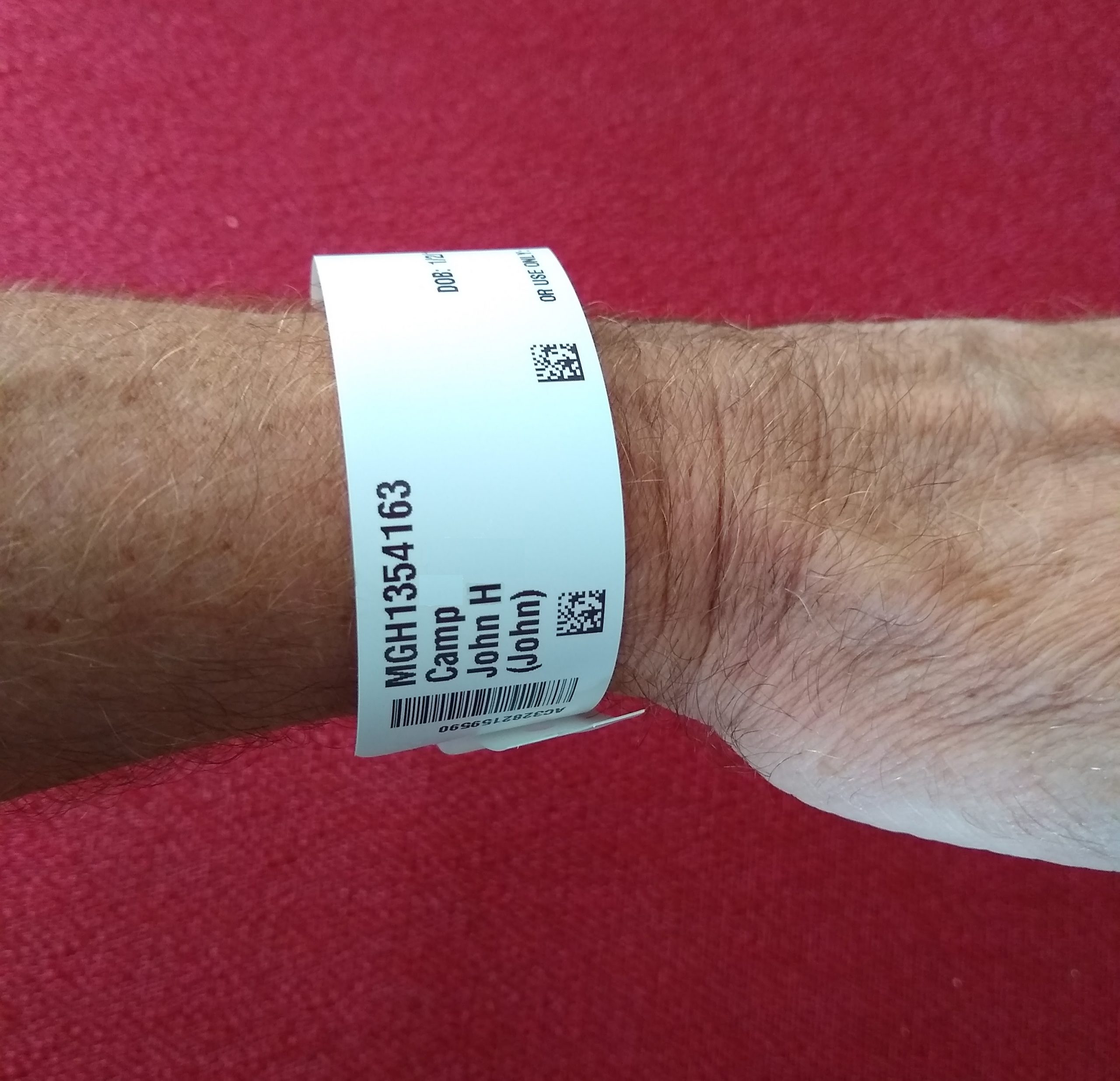 “Wrist Identification Band.jpg” by Whoisjohngalt is licensed under CC BY-SA 4.0 Photo showing closeup of a patient identification band
