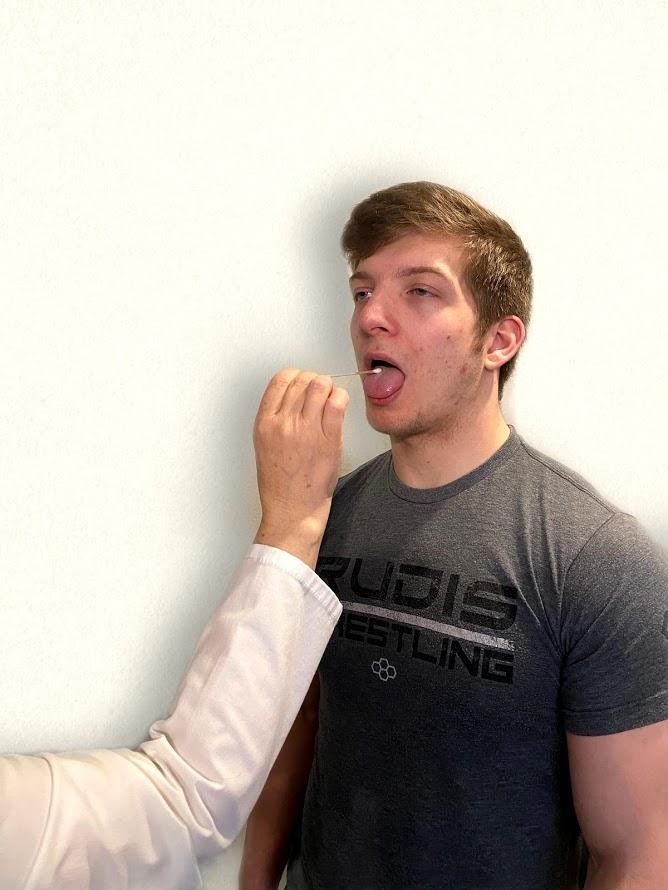 "Neuro Exam Image 17.png" by Meredith Pomietlo for Chippewa Valley Technical College is licensed under CC BY 4.0 Photo of simulated patient having a cotton swab placed on his tongue by nurse