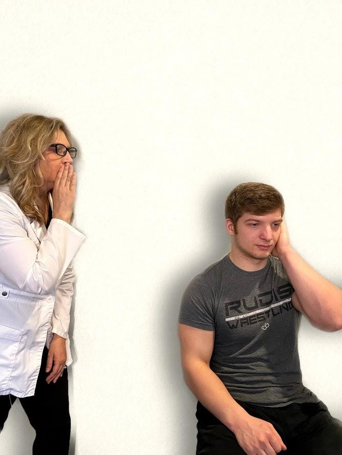 "Whisper Test Image 1.png" by Meredith Pomietlo for Chippewa Valley Technical College is licensed under CC BY 4.0 Photo showing a nurse whispering to simulated patient to assess hearing