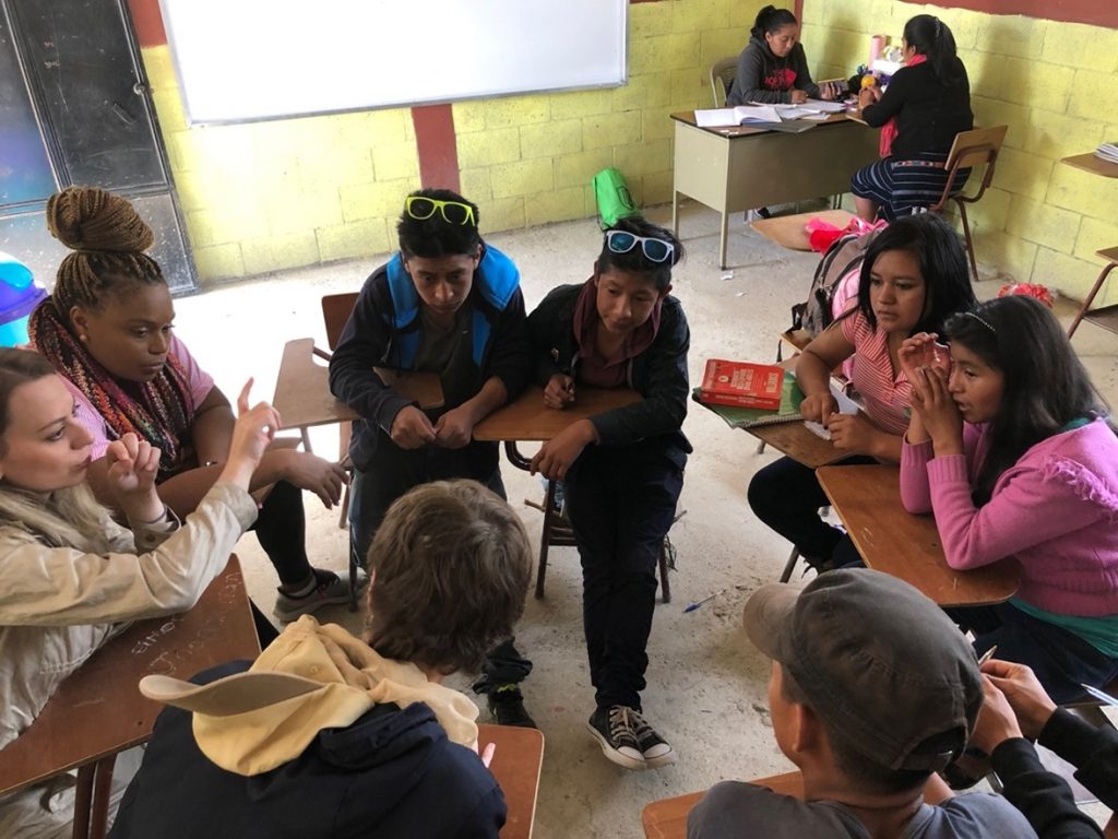 students sitting in a circle talking