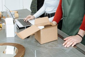 students measuring a cardboard box