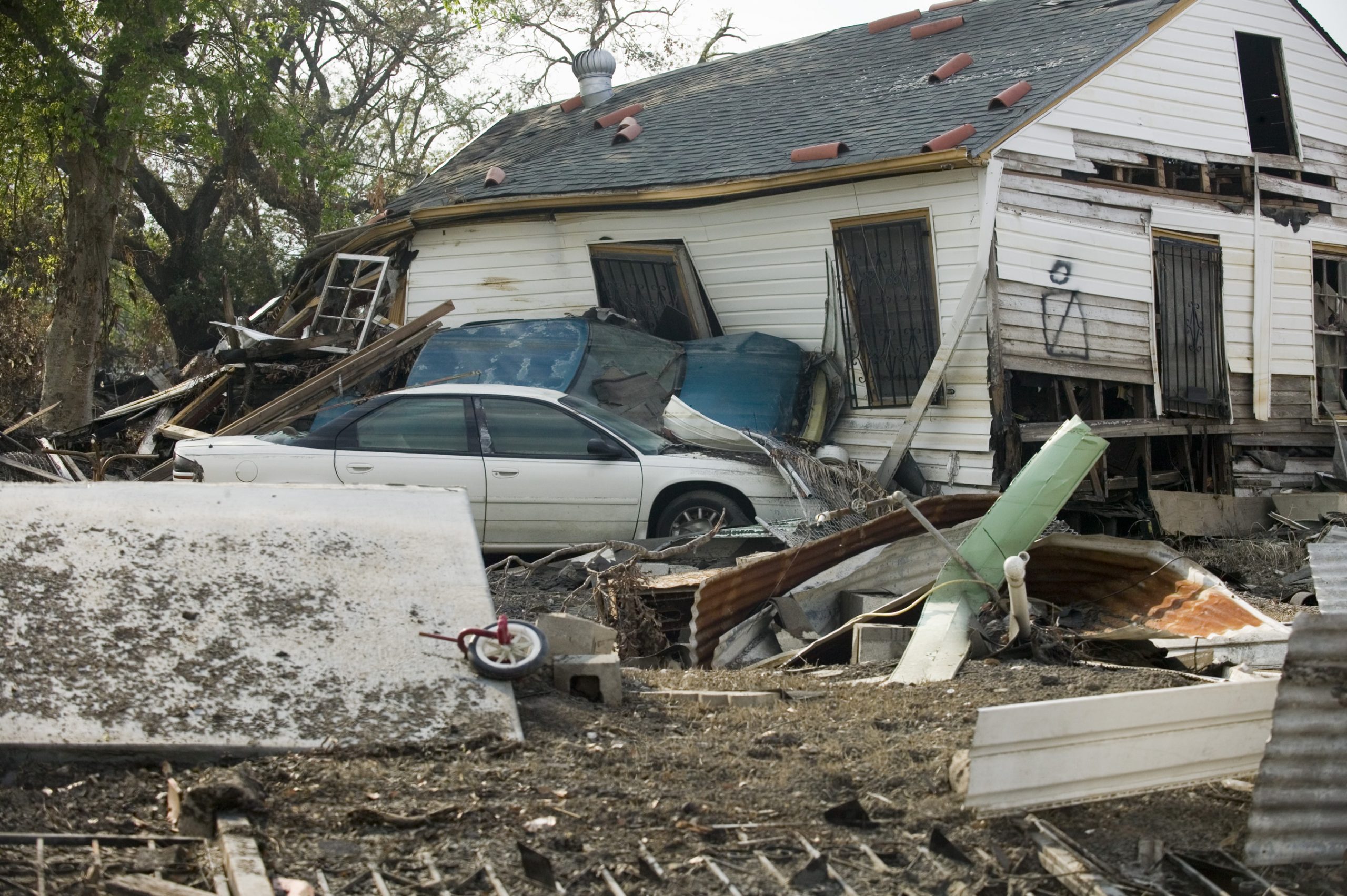 ”LA_1603_9thDistDam121.jpg” by Booher, Andrea, Photographer is in the Public Domain. Photo showing destruction Effects of Hurricane Katrina