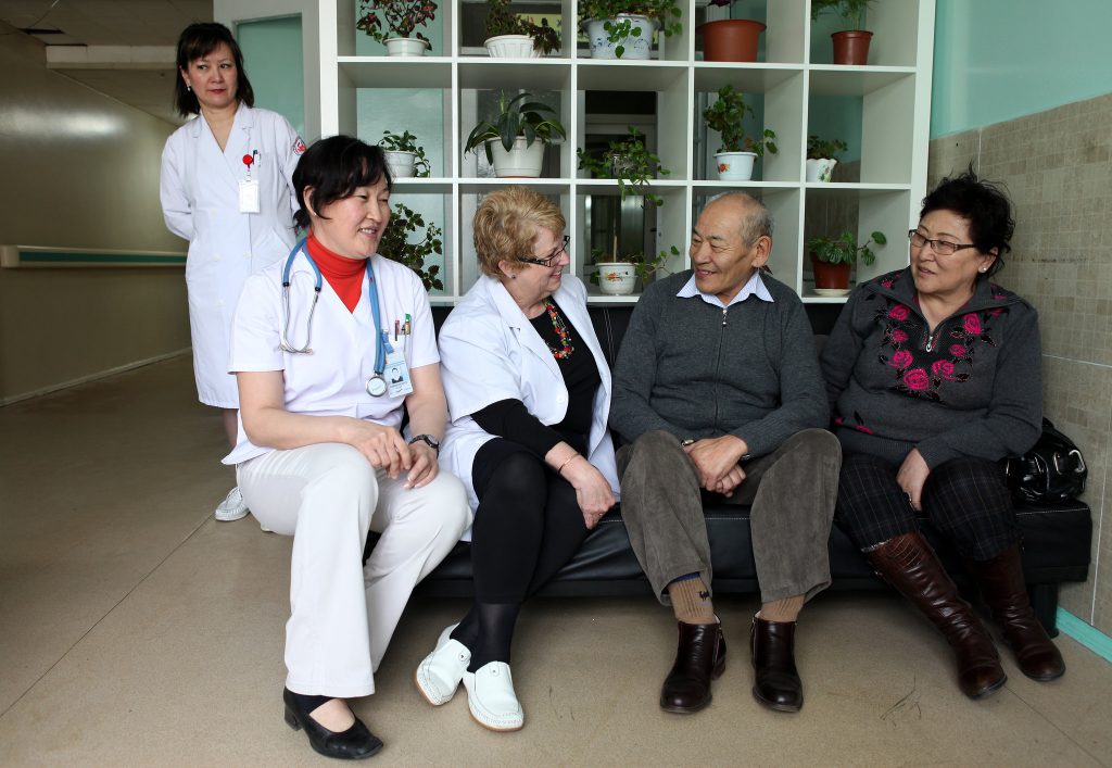 ”10716898813_74292ef548_k” by Department of Foreign Affairs and Trade is licensed under CC BY 2.0 Photo showing five people engaged in a support group for caregivers
