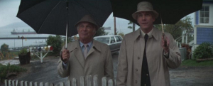 two men with umbrellas