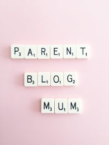 Scrabble tiles spelling out parent, blog, and mum.