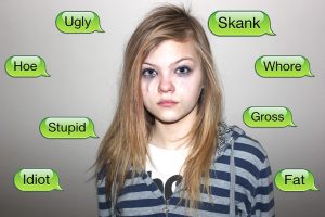Woman who has been crying surrounded by a number of demeaning words.