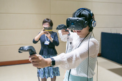 Child with virutal reality headset on.